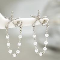 Damenohrringe - Kleine sternförmige Muschel mit Perle. Ohrringe mit Hochwertigem Stil und Vielseitiger Ausstrahlung.