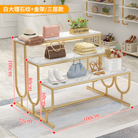 Présentoir de Magasin de Vêtements Moderne en Métal avec Base Dorée, Table à Escalier et Étagère à Chaussures pour Salon