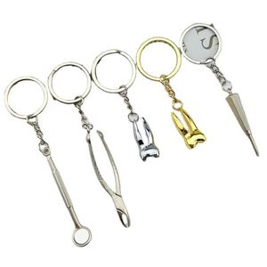 SY2827 Creative <b>Mini</b> Dental Molar Tooth Shaped Keychain Teeth Metal Key Chains Dental Promotional Gifts Dentist Keychain - Product Image 1