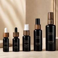 YAN Packaging - Juego de Botellas de Vidrio Violeta/Negro de Lujo de 30ml y 50ml con Gotero y Pulverizador, con Tapa de Madera Natural, para Aceite Facial y Cosméticos