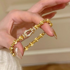 Bracciale Trendy con Fibbia a Ferro di Cavallo Effetto Occhio di Gatto Dorato, Bracciale Elastico Vintage di Alta Gamma per Feste - Product Image 1