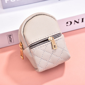 Sac de maquillage circulaire léger en cuir PU, vente en gros d'usine, avec poche à clés, sac à rouge à lèvres, mini sac à dos, porte-monnaie, pendentif pour femme - Product Image 5
