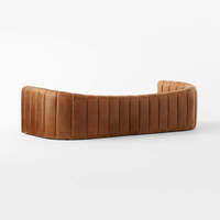 Canapé en cuir véritable capitonné, long et incurvé, à assise profonde, pour salon d'hôtel 5 étoiles haut de gamme