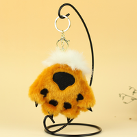 Vente en gros de mini peluches simulant une patte de tigre, pendentif en peluche avec griffe d'ours en léopard, jouets en peluche OEM ODM pour cadeau