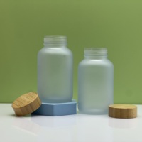 Bouteille de capsule en verre à large bouche 200cc pot de bouteille de pilule en verre pour pilules médicales avec bouchon en bambou en bois