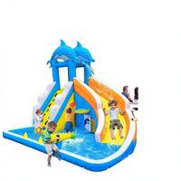 Parc aquatique gonflable sur le thème des dauphins avec piscine à jets, mur d'escalade et toboggan, en PVC de qualité commerciale pour la location par les enfants