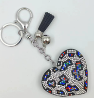 Koningsblauwe modieuze sleutelhanger met luipaardprint, hartvormig, volledig bezet met strass steentjes en kwastjes, best verkochte charme hangende ornament