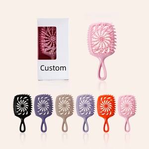 فرشاة شعر محمولة جديدة لعام 2025 بتصميم مجوف للتدليك، مقاومة للحرارة، فرشاة شعر صغيرة الحجم كسلسلة مفاتيح للترويج - Product Image 1