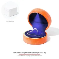 Boîte à bijoux ronde en velours haut de gamme avec éclairage LED, boîte à bagues lumineuse, motif circulaire, bracelet, collier, pendentif