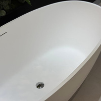 Gurgle Local Stock US Baignoire autoportante en pierre artificielle blanche mate Texture ardoise Surface solide Forme ovale Baignoire de trempage