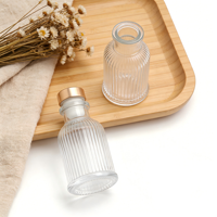 Bouteille diffuseur d'arômes en verre transparent rond vide de 50 ml avec logo personnalisé pour salle de bain