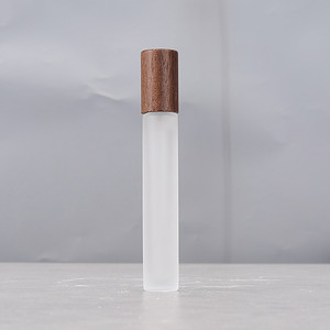 Luxury Custom Empty Small Refillable 3ml-30ml <b>Mini</b> Glass Perfume Roll on <b>Bottles</b> Clear Surface Cylinder Wooden Cap - Product Image 1