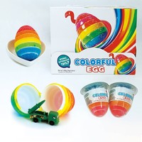 Bonbons gélifiés multicolores en forme d'œuf aux saveurs fruitées avec jouet à l'intérieur pour enfants, vente en gros OEM
