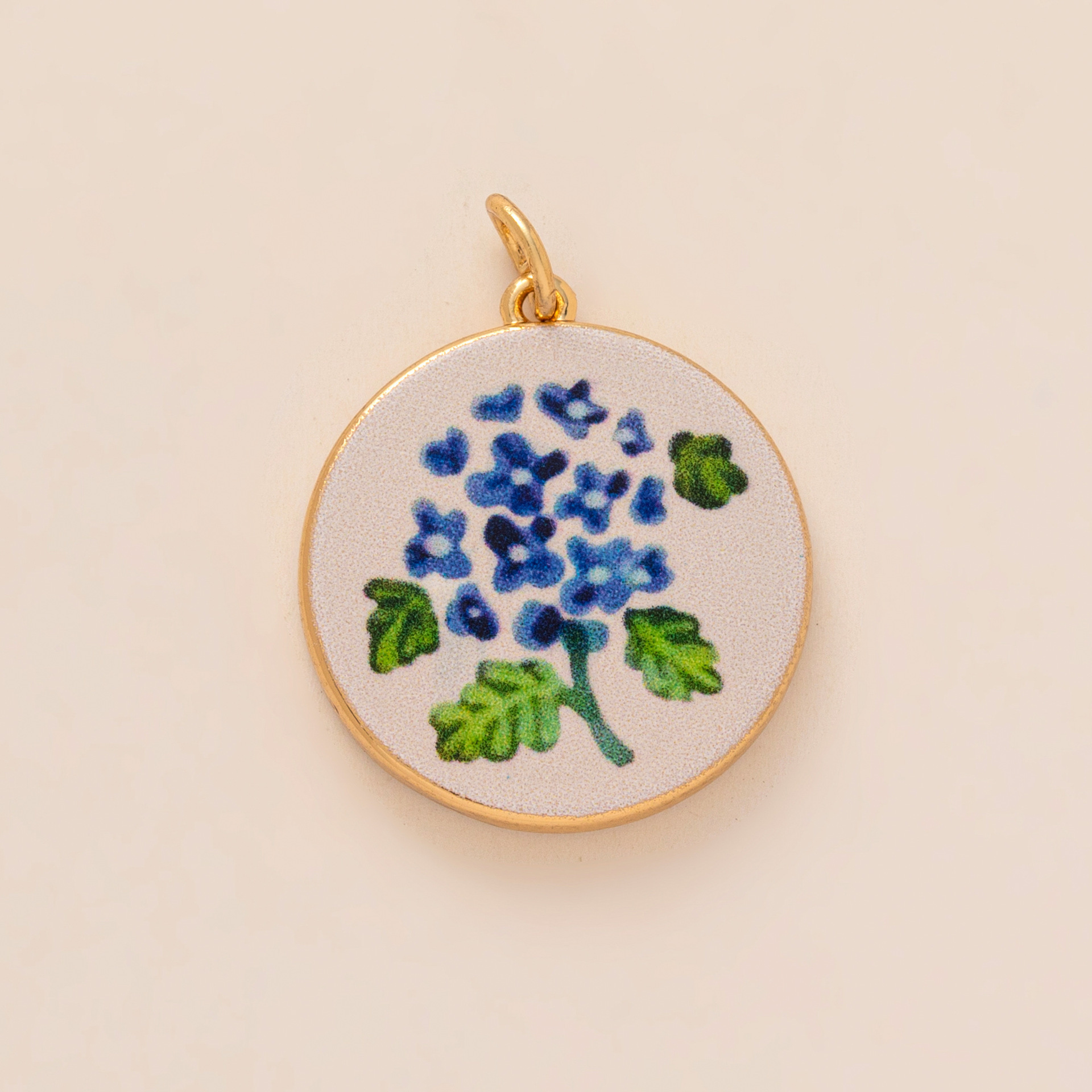 pendentif petite fleur bleue
