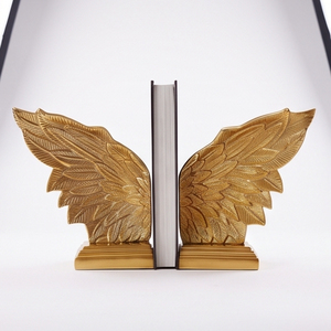 Serre-livres en métal décoratif avec design d'ailes d'ange, finition dorée, élégant organisateur d'étagère pour la maison, le bureau, la bibliothèque, la présentation sur le bureau - Product Image 1