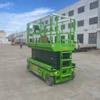 Plateforme élévatrice à ciseaux électrique tout-terrain Tuhe, construction en acier au manganèse, système hydraulique à haute traction, capacité de 300 kg, levage de 10 m