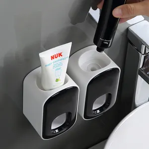 Hot Selling Bathroom Wall Mounted Toothbrush Holder Automatic Toothpaste Dispenser Toothpaste Squeezer