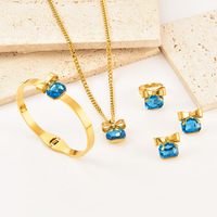 Ensemble de bijoux tendance pour femmes en acier inoxydable 316 et cristal, nœud papillon en strass, collier, bracelet, boucles d'oreilles, bague - plaqué or 18 carats