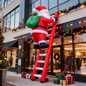 Sac cadeau géant gonflable personnalisé Père Noël grimpant l'escalier, en tissu Oxford durable et résistant au soleil pour centres commerciaux et Noël en extérieur - Product Image 1