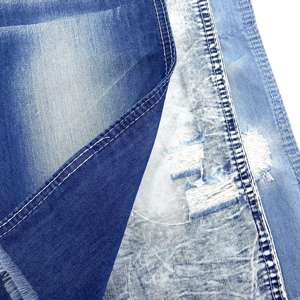 Jeans de mujer personalizados al por mayor, en índigo, blanco, con estampado, tela lavada, desgastada, encerada, vintage, de mezclilla elástica de algodón y spandex. - Product Image 2
