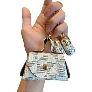 Luxury Durable High Quality Simple Soft Foldable Irregular Shape Keychain Mini Coin Purse Earphone <b>Bag</b> <b>Charm</b> Fashion Leather - Product Image 1