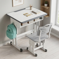 Ensemble bureau et chaise bleu clair pour enfants avec indentations ergonomiques et cadre réglable pour l'étude des enfants