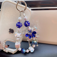 Breloque de téléphone papillon bleu en strass et perles, pendentif de sac artisanal lourd, cordon de poignet, cadeau bijoux pour femme