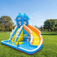 Parc aquatique gonflable sur le thème des dauphins avec piscine à jets, mur d'escalade et toboggan, en PVC de qualité commerciale pour la location par les enfants