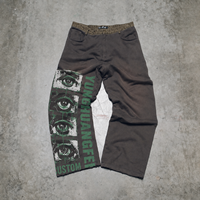 Fabricant de vêtements streetwear pour hommes, pantalons en jean délavé personnalisés OEM ODM avec imprimé graphique œil et ourlet brut, coupe large