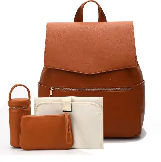 حقيبة ظهر من الجلد الصناعي المتين للسفر حقيبة ظهر صغيرة كلاسيكية للحفاضات يمكن تحويلها إلى حقيبة مع وسادة للتغيير