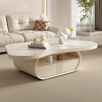 Table basse OEM en marbre véritable de style crème français, avec plateau surélevé, porte coulissante cannelée et étagère ouverte, personnalisable pour salon
