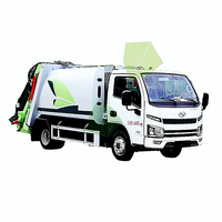 Camion poubelle à levage et compression