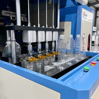 Machine de soufflage de bouteilles en plastique PET semi-automatique 4 cavités 100ML à 1.5L Prix Machine de moulage par étirage de bouteilles de boissons