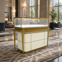 Vitrine de présentation de bijoux de luxe sur pied en verre trempé avec éclairage LED intégré, finition dorée, noir brillant, pour la vente au détail