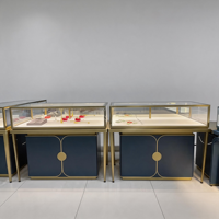 Vitrine de présentation de bijoux de luxe, cadre en or brossé, armoire bleu marine, mobilier moderne pour boutique de détail