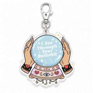 Porte-clés humoristique pour la vente en gros : « Je vois traverser votre connerie » avec breloque boule de cristal, en vrac - Product Image 1