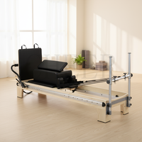 Reformer Pilates en érable avec barre de pieds coulissante pour équipement de fitness à domicile favorisant l'entraînement de renforcement du tronc