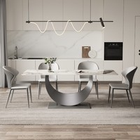 Table à manger rectangulaire minimaliste italienne en pierre frittée avec base incurvée en acier inoxydable brossé, mobilier de maison robuste