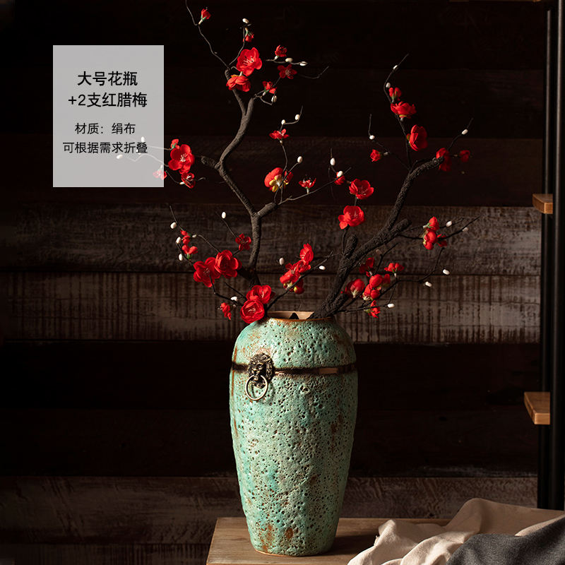 Dos ramas grandes de *Wintersweet* rojo.