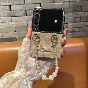 เคสฝาพับสุดหรูใหม่ล่าสุดเคสโทรศัพท์มือถือแวววาวแบบพับได้พร้อมสร้อยข้อมือมุกสำหรับ Samsung <span class=keywords><strong>Xiaomi</strong></span> Motorola - Product Image 1