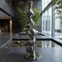 Miroir de hall de villa de style minimaliste contemporain sur mesure, sculptures en acier inoxydable en forme de pierres empilées