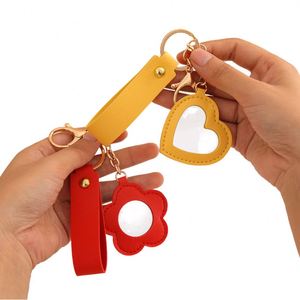2025 Vintage Style Luxury PU <b>Leather</b> Flower Heart Bag Charm <b>Keychain</b> Creative Zinc Alloy Mirror Car Bag Pendant Keyring Gifts - Product Image 1
