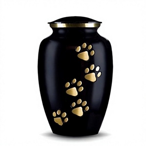 Urne funéraire cylindrique en métal noir avec empreintes de pattes dorées – Cadeau de sympathie au design moderne et durable, thème animalier - Product Image 1