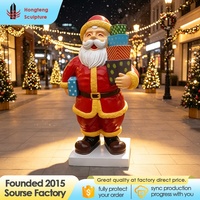 Statue de Père Noël grandeur nature en résine de fibre de verre de haute qualité, personnalisée en usine, pour la décoration extérieure des centres commerciaux et l'artisanat