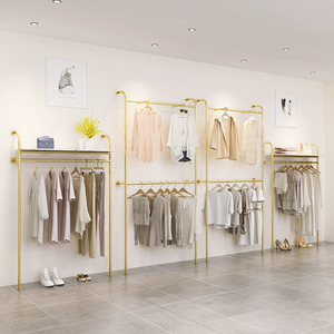 Porte-vêtements mural en métal doré de luxe léger, idéal pour les boutiques de vêtements - Product Image 1