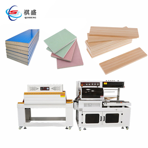 Machine d'emballage de paquet de Film rétractable de panneau de porte en bois Machine d'emballage de panneau de gypse de plancher en bois pour des panneaux - Product Image 1