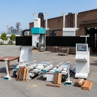 Machine de fraisage CNC industrielle 5 axes haute performance à double table pour la production de meubles en bois massif
