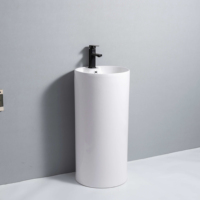 Lavabo rond minimaliste autoportant en céramique avec piédestal sans joint, équipement sanitaire pour projets de rénovation de salles de bain d'hôtels et de complexes hôteliers