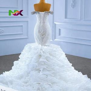 ชุดแต่งงานเจ้าหญิงทรงทรัมเป็ตแบบสั่งตัดพิเศษ ดีไซน์เกาะอก แต่งลูกไม้ผูกด้านหลัง ประดับลูกปัดและเลื่อมระยิบระยับ พร้อมระบายหรูหรา - Product Image 1