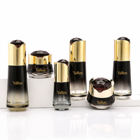 Ensemble de flacons et pots cosmétiques en verre noir dégradé de luxe avec bouchon doré brillant pour sérum et crème de soin